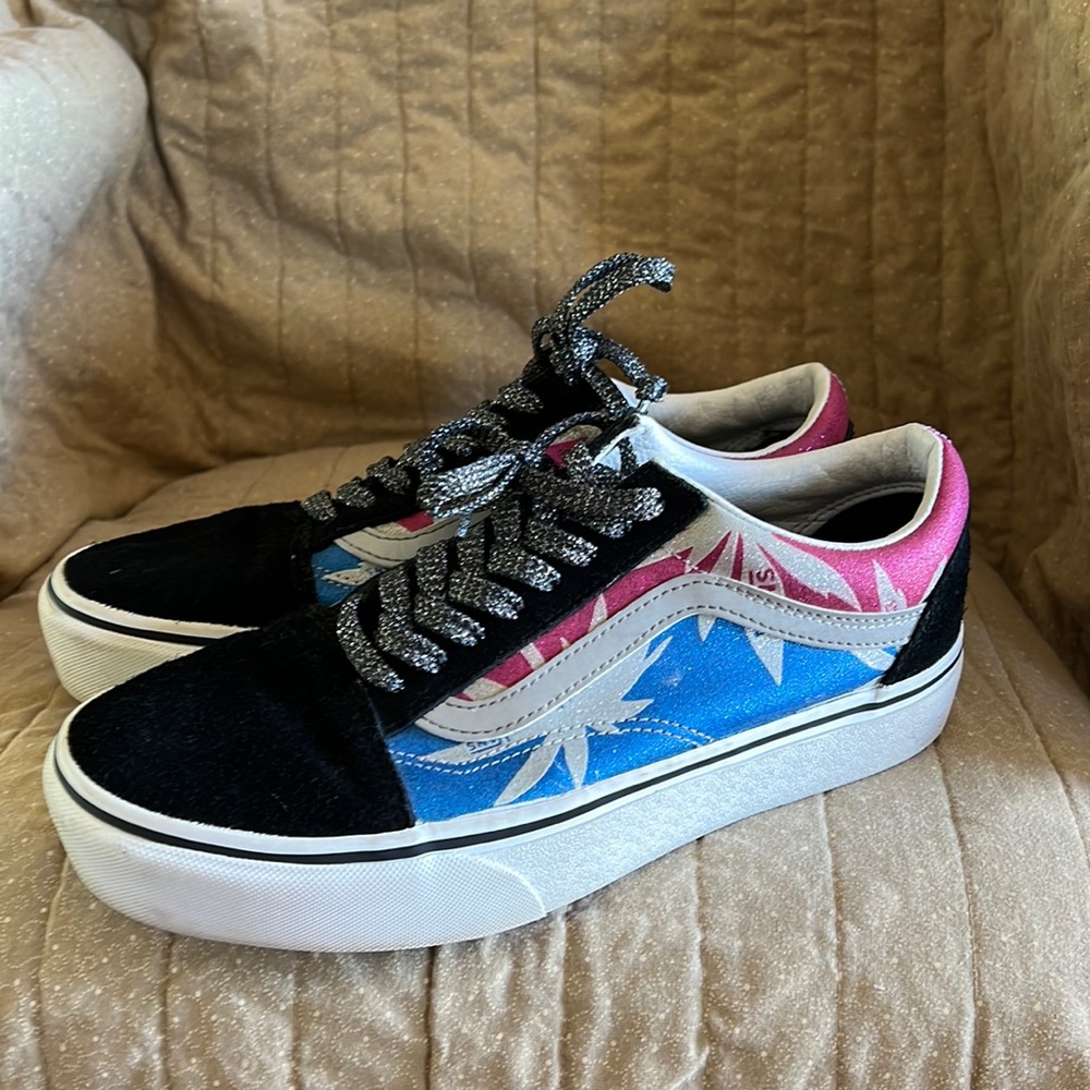 Pink and blue vans with flower background. Glitter laces